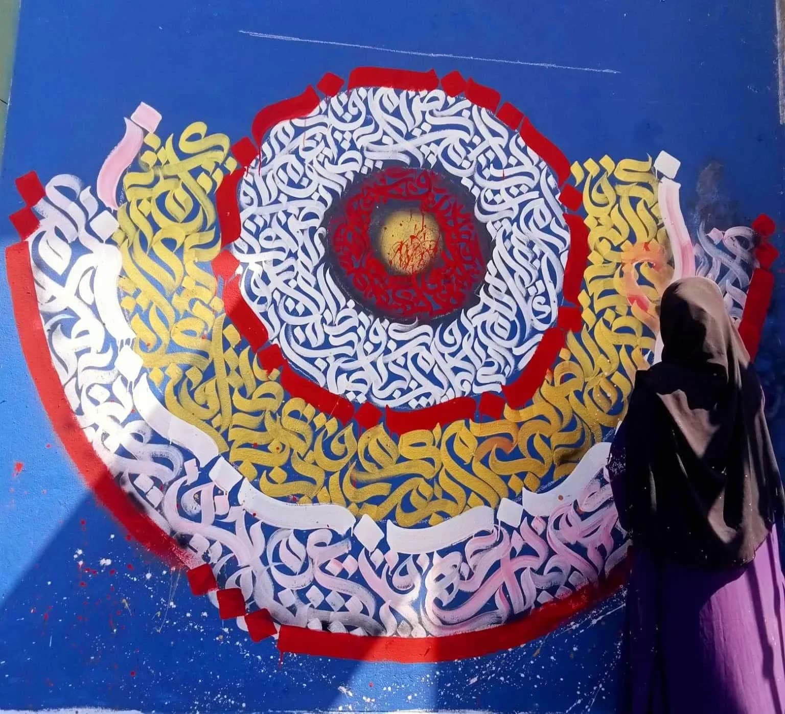 Painting a calligraphy mural