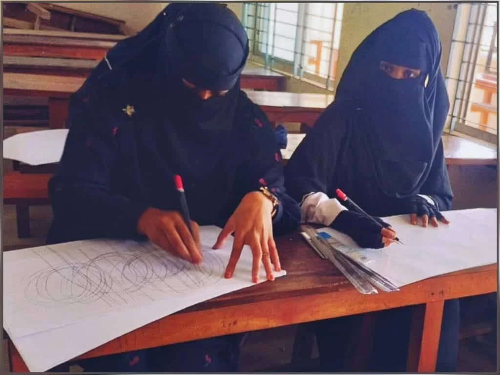 Two students painting together