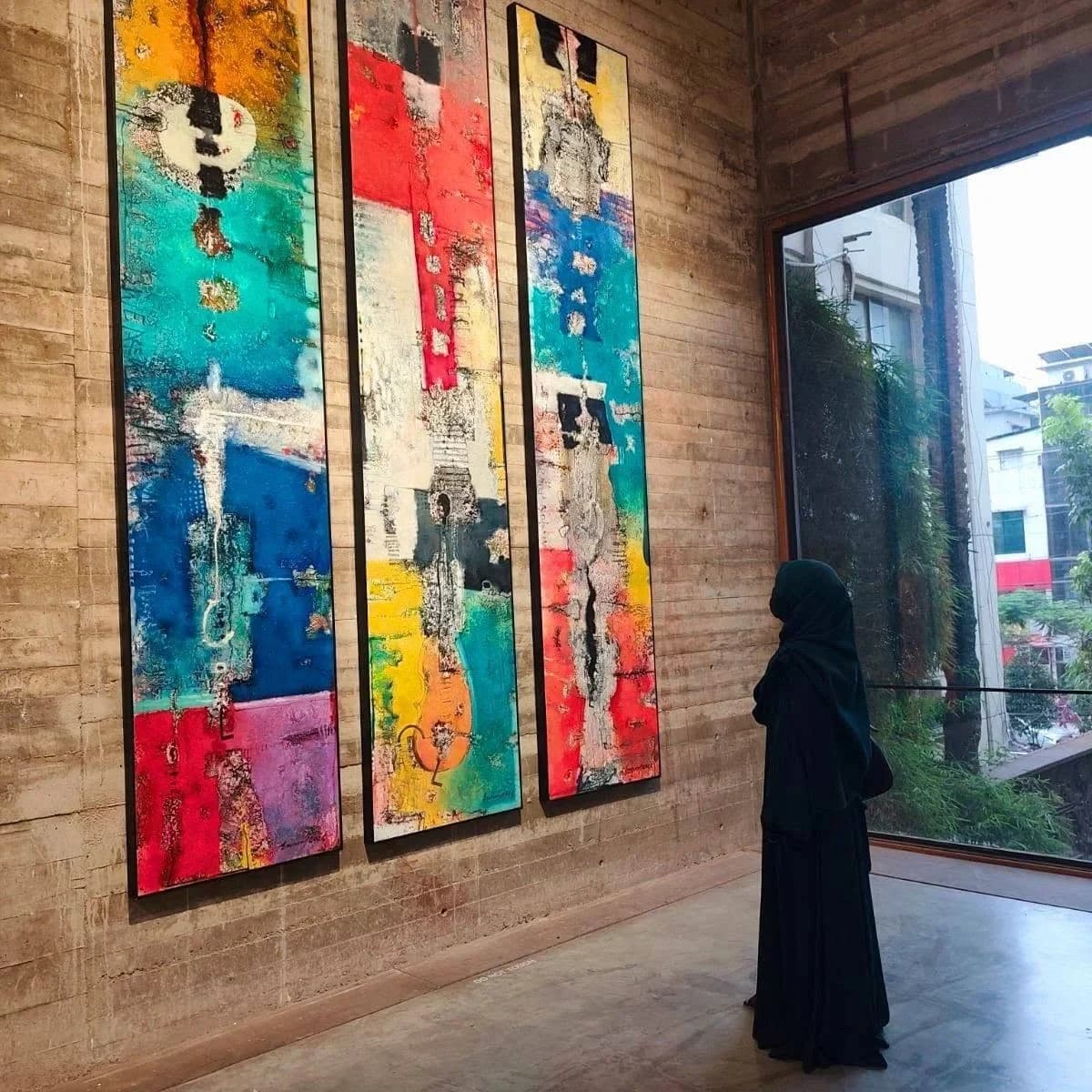 Abstract triptych on an exhibition wall