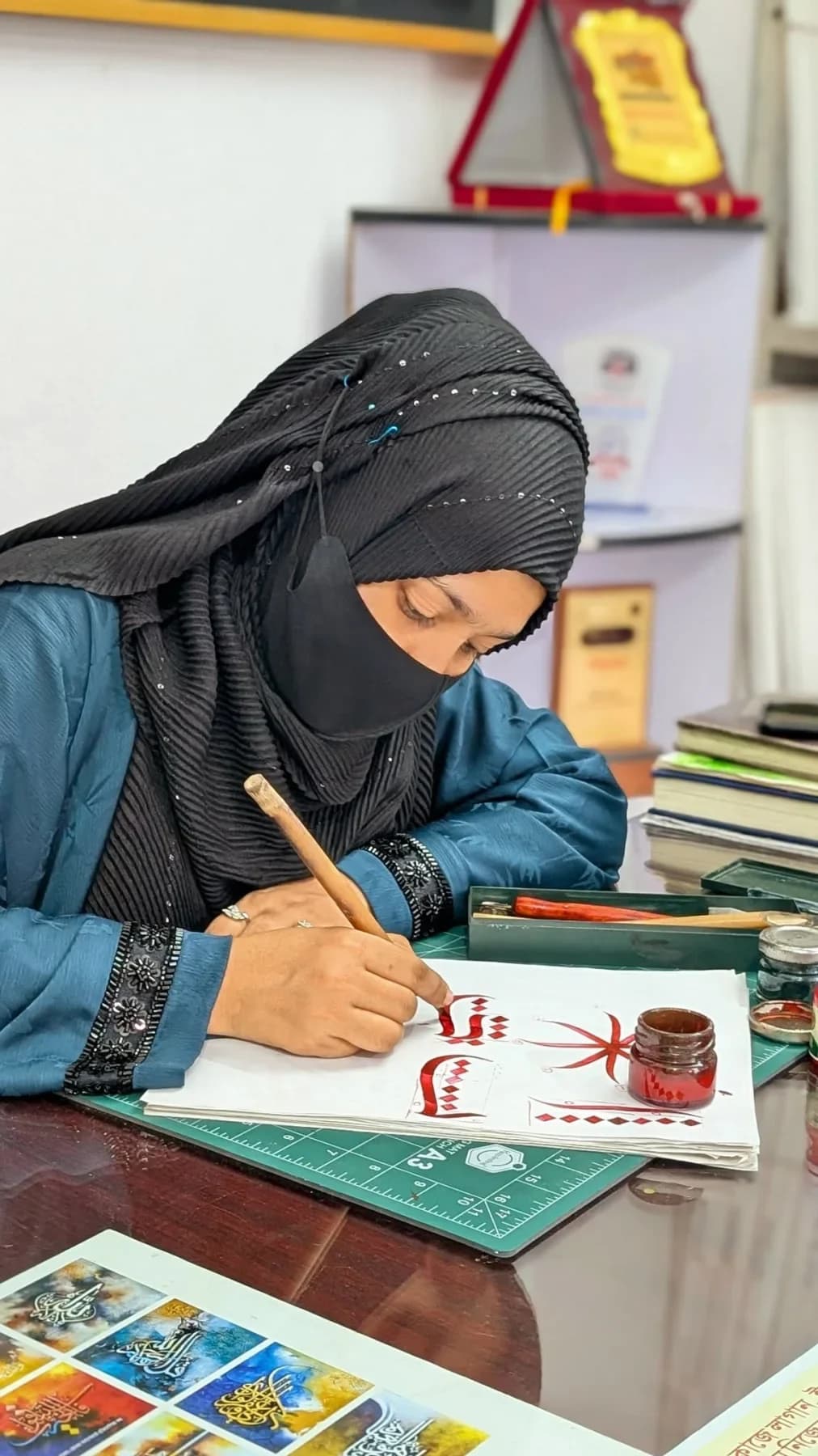 Lubna Akter at her desk